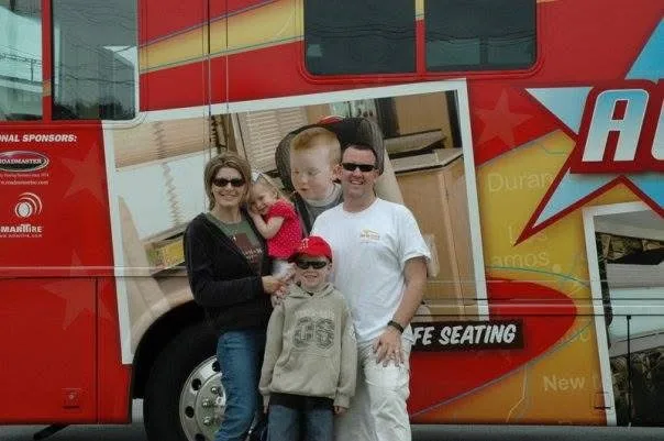 Craig, Kellie and their children beside the family RV