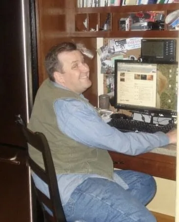 Craig sitting at a computer in 2009